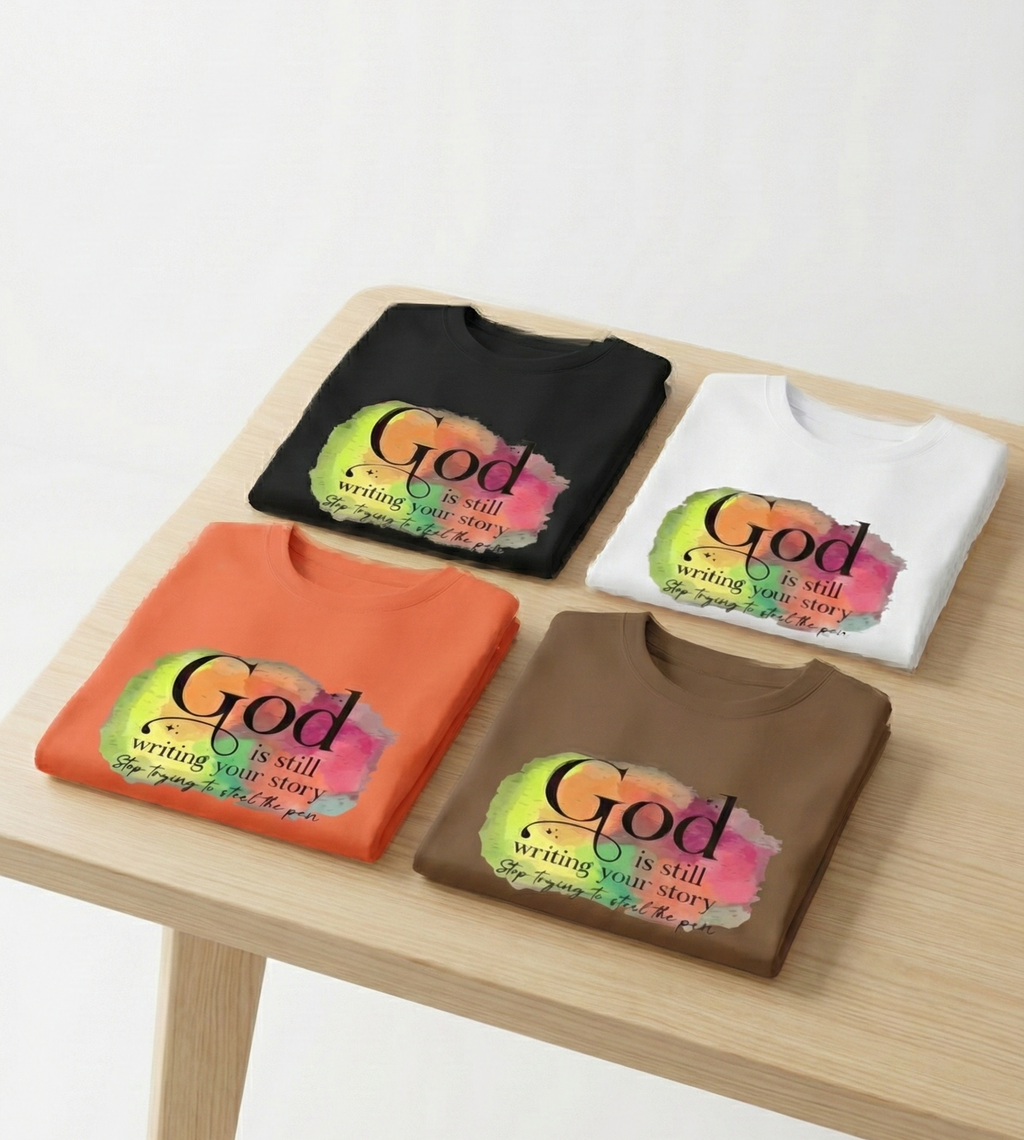God Is Still Writing Your Story Christian T-Shirt Inspirational Faith Watercolor Graphic Tee for Men & Women Religious Encouragement Gift